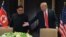 Donald Trump y Kim Jong Un en Sentosa.